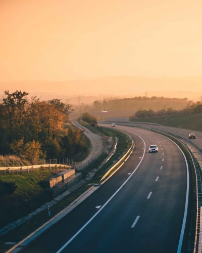 aerial-view-of-a-truck-on-an-empty-highway-with-tr-2025-02-02-20-24-01-utc_11zon